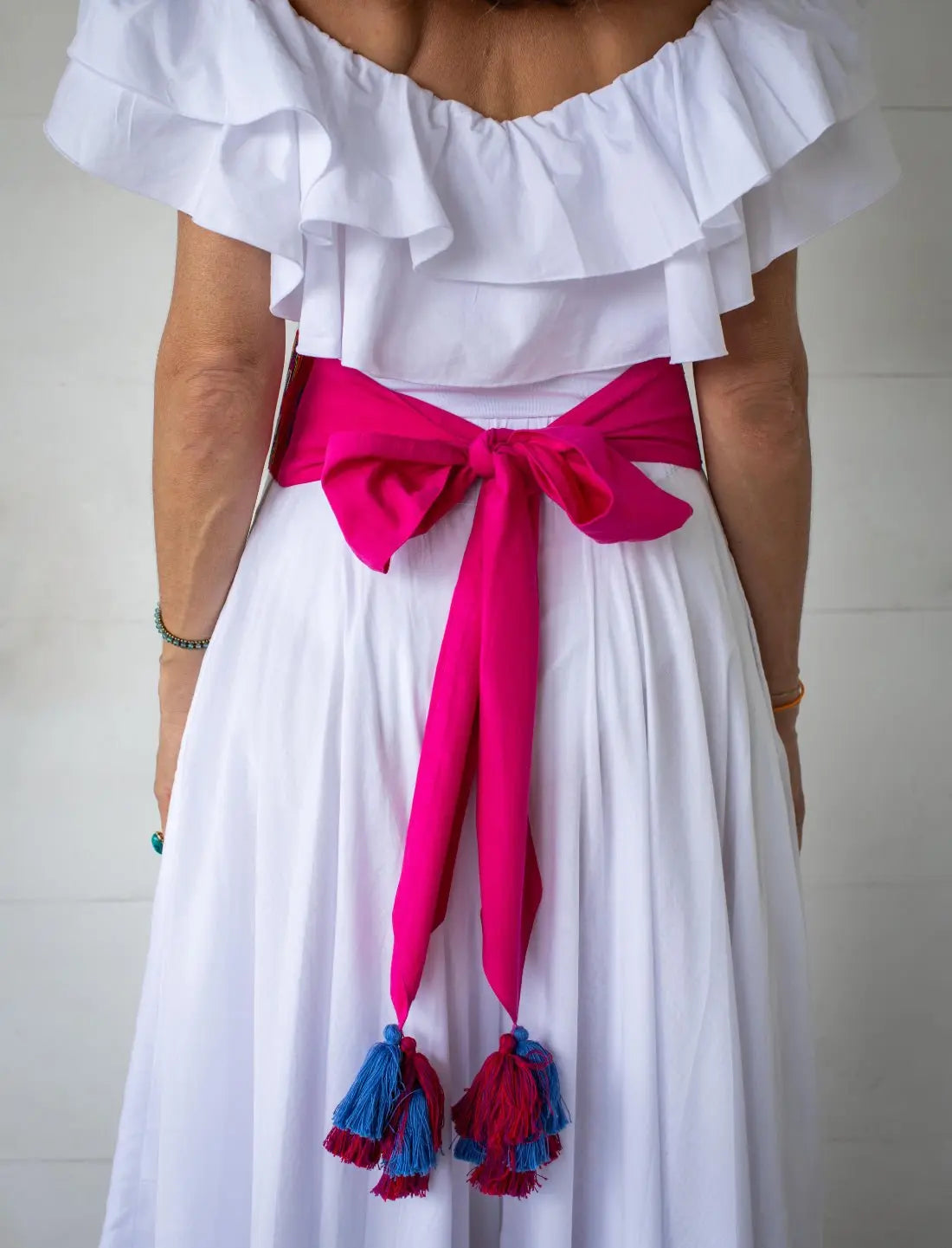 Timar Varja Vibration Red Multicolored Belt  includes a soft pink sash with colorful tassels on the end.